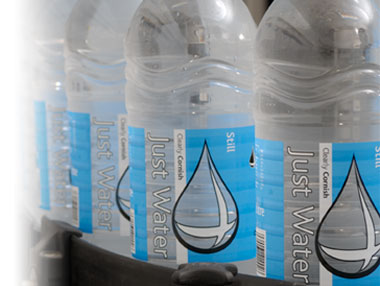 Four plastic Just Water bottles