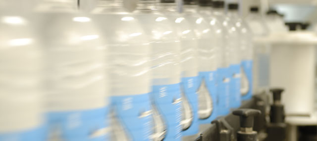 Row of two litre bottles in the bottling plant