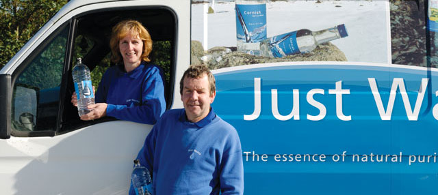 The Dyers holding two litre bottles of water